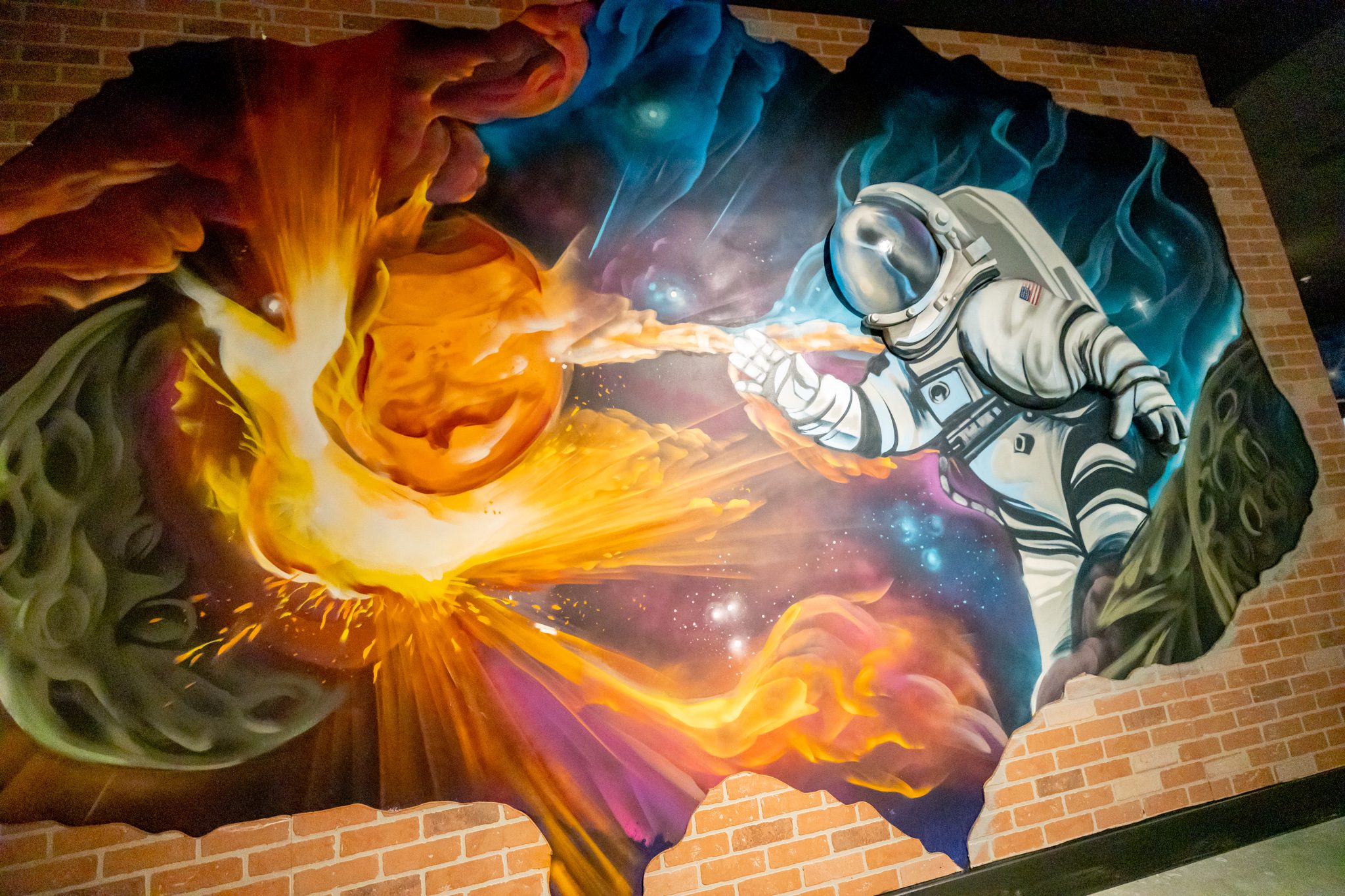 Dynamic street mural of a cosmic battle: Meteors vs. Spacemen in the city.