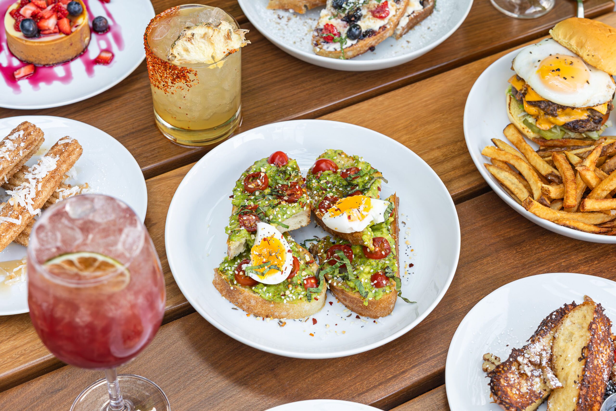 a spread of brunch food like avocado toast and more